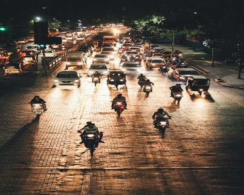 Commuters traveling in an Indian city transport system