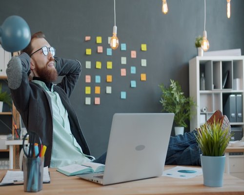 Office worker taking a mindful break from laptop screen